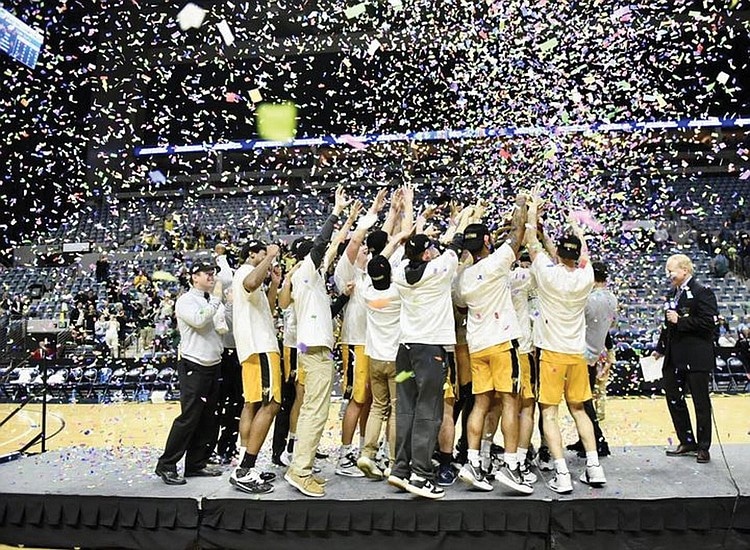 Macon Division 3 Basketball team celebrates a championship win with confetti