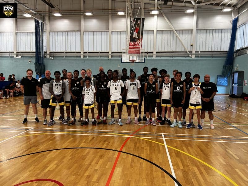 Youth Boys Basketball team stands together on the court in London