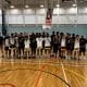 Youth Boys Basketball team stands together on the court in London