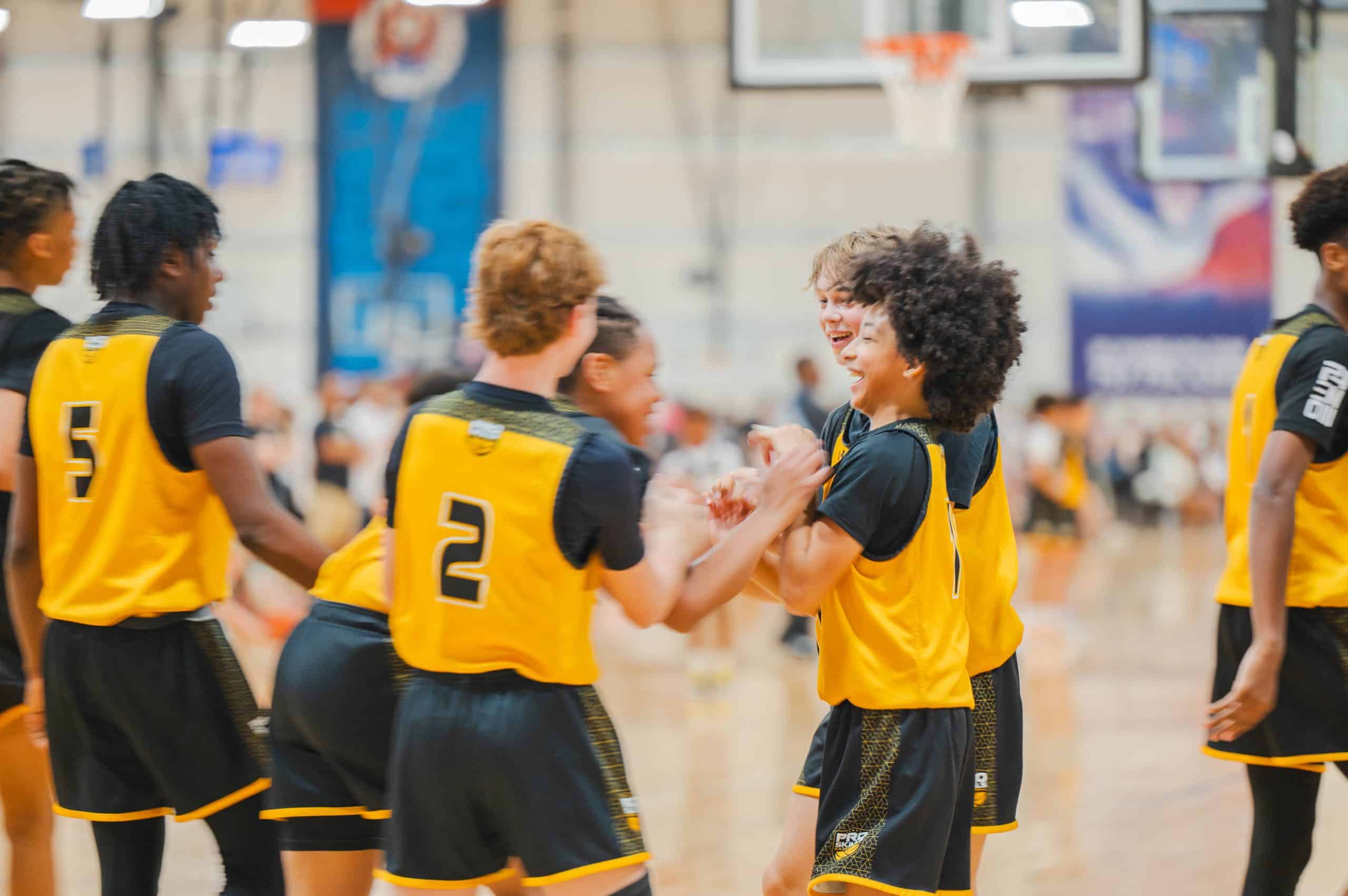 PSB youth basketball players celebrating together during AAU tournament