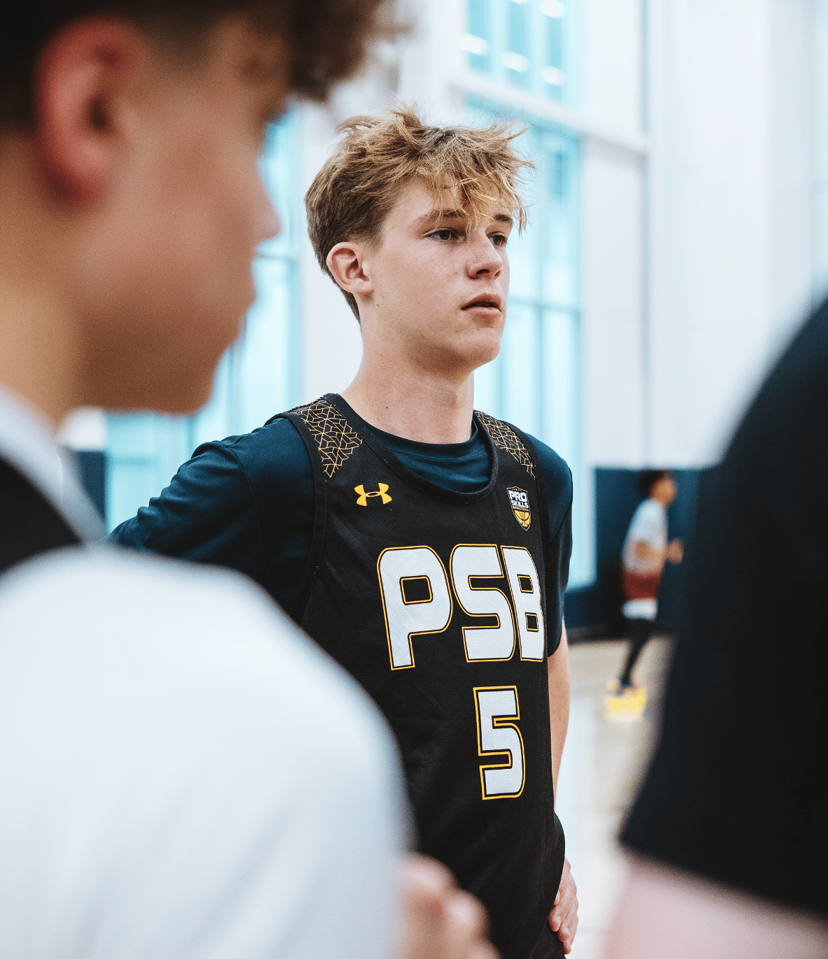 High school basketball player portrait in a tournament jersey