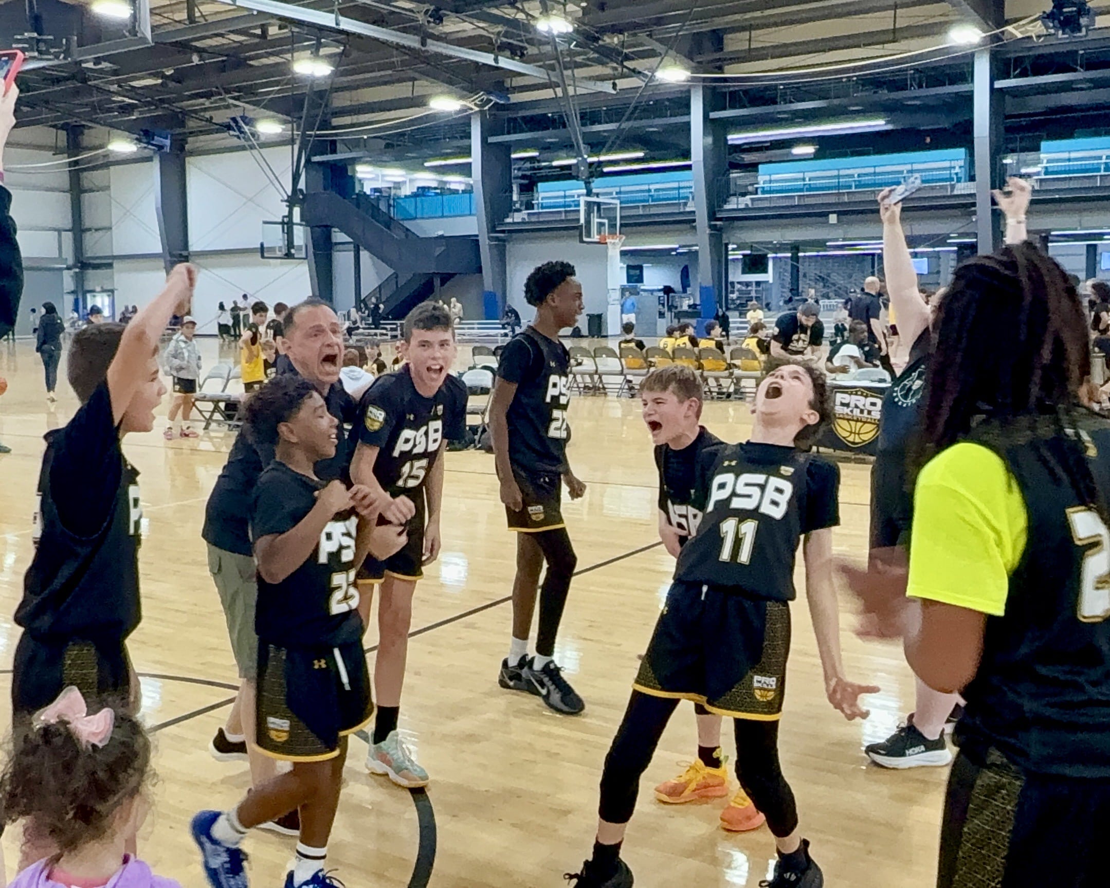 boys team celebrating cheering dark psb jerseys sports center