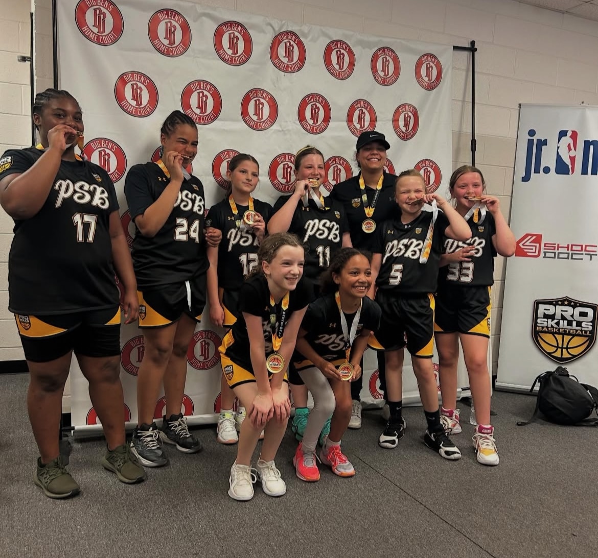PSB championship team celebrating with medals