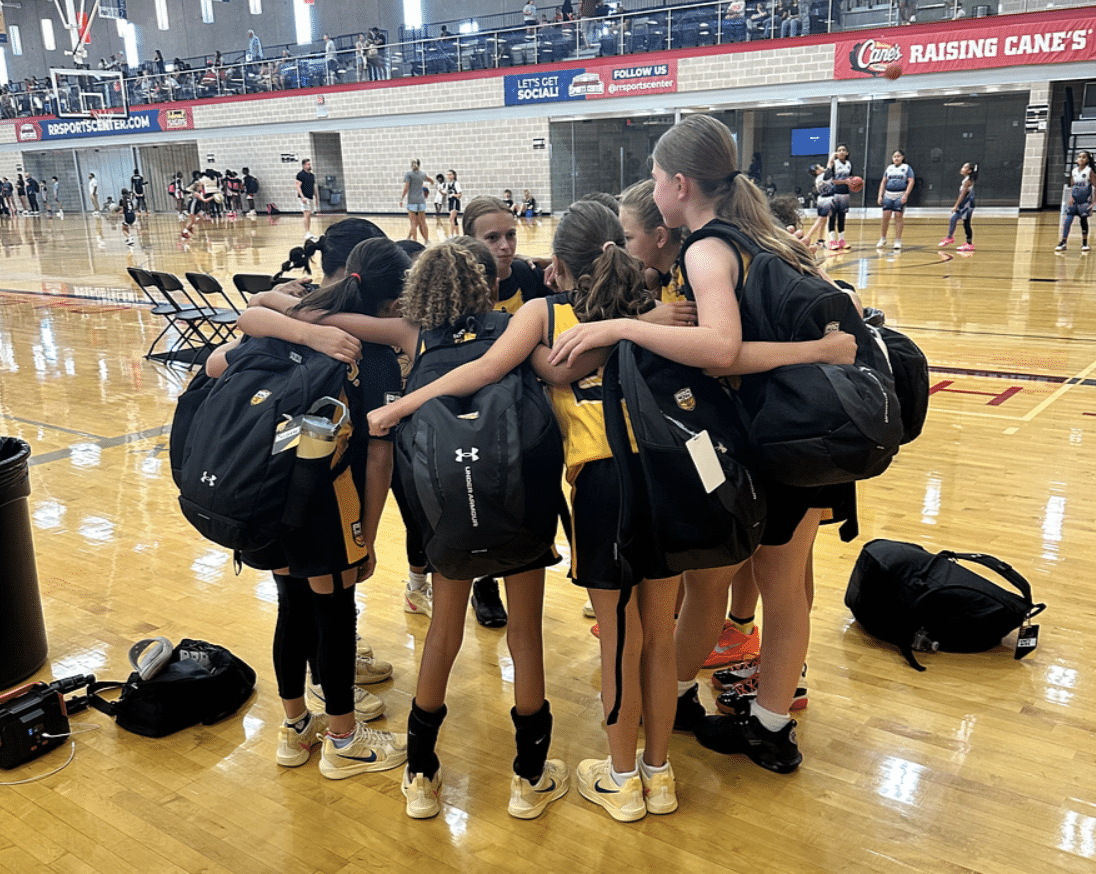 Youth basketball team huddle before a game