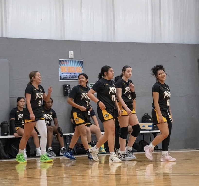 PSB girls basketball players walking onto the court before a game showing the focus and mental preparation that builds mental toughness