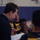 PSB coach talking with a 6th grade player on the sideline