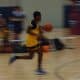 6th grade PSB player dribbling on a fast break