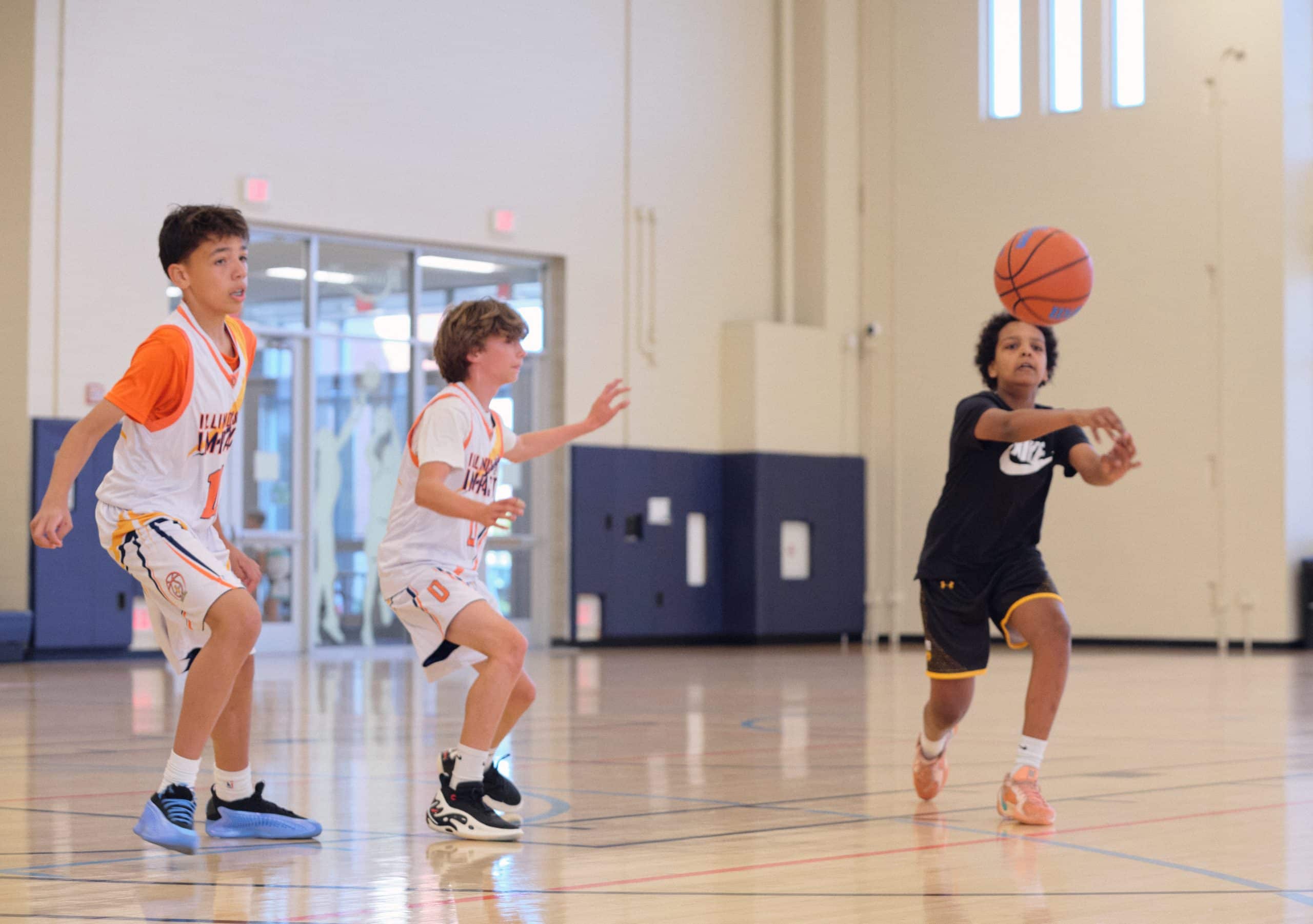 Youth basketball player dribbling in a game