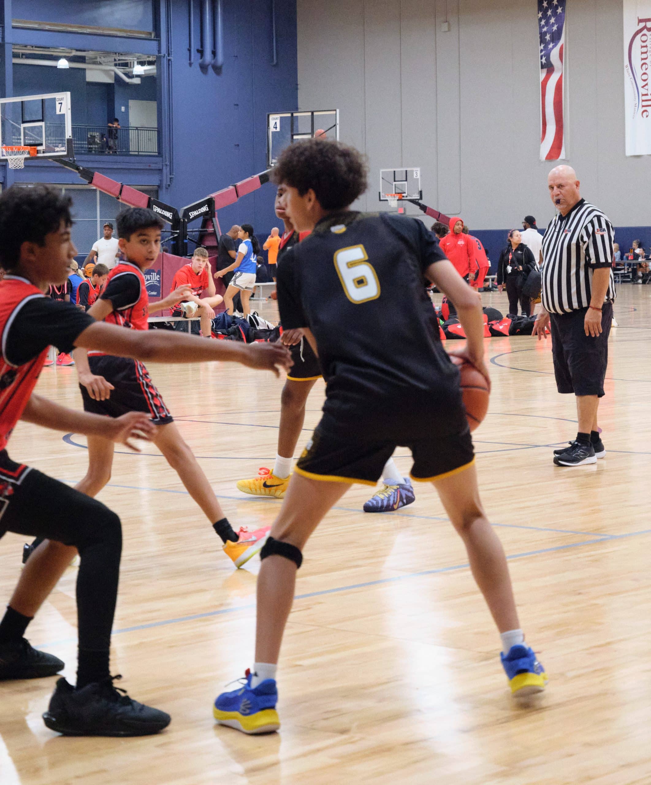 Teen basketball player competing in a tournament game