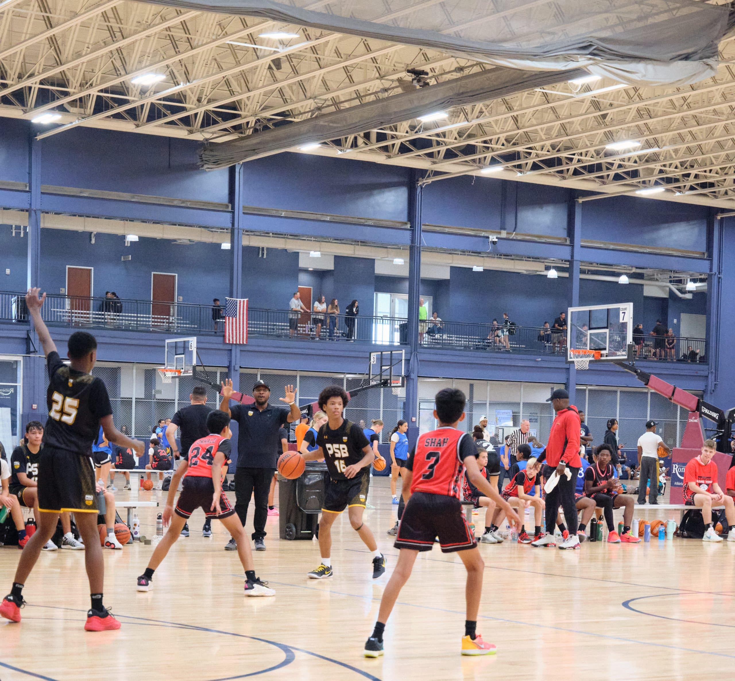 High school player taking a jump shot in a game