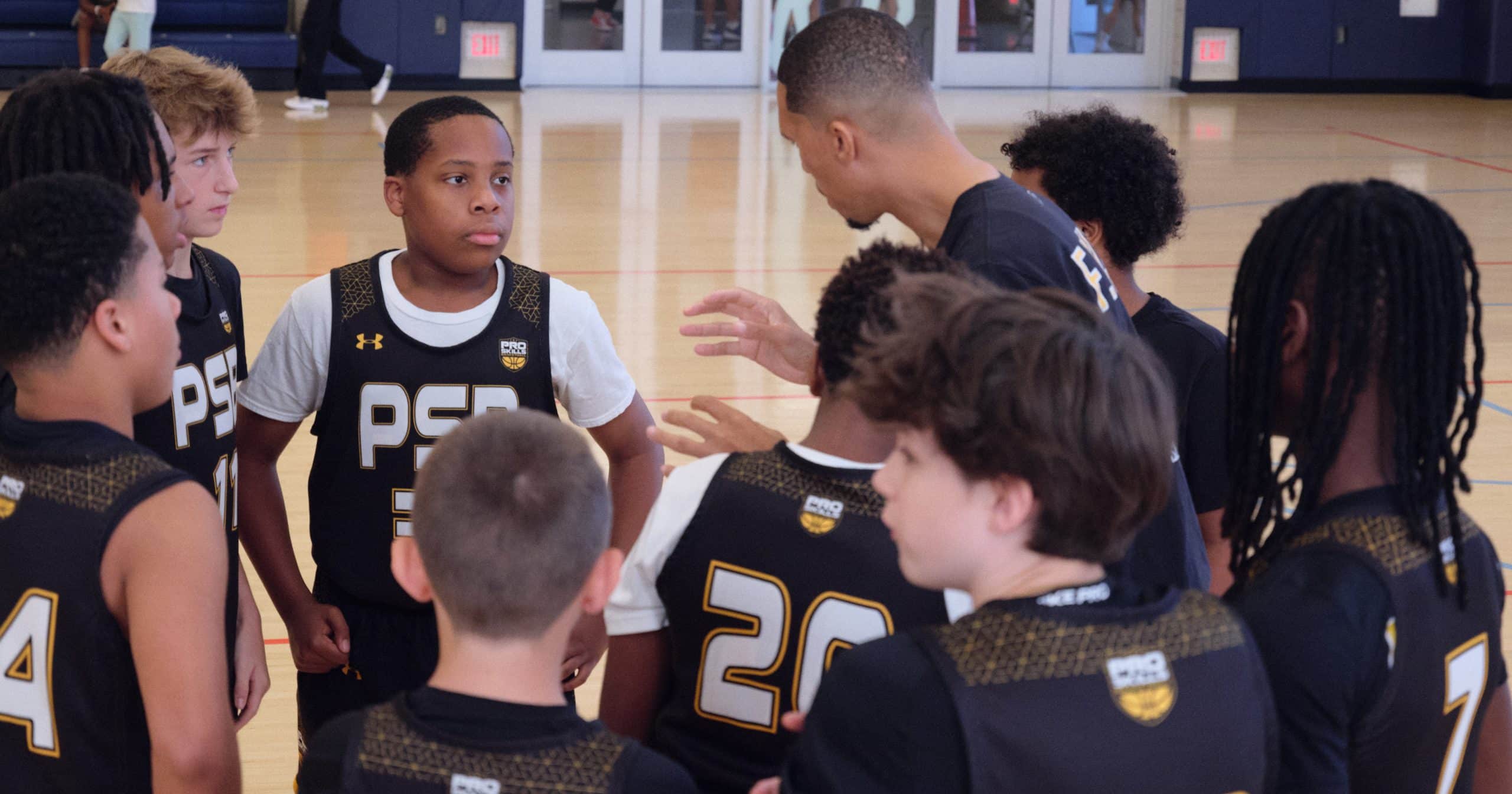Player and coach on the sideline during a game