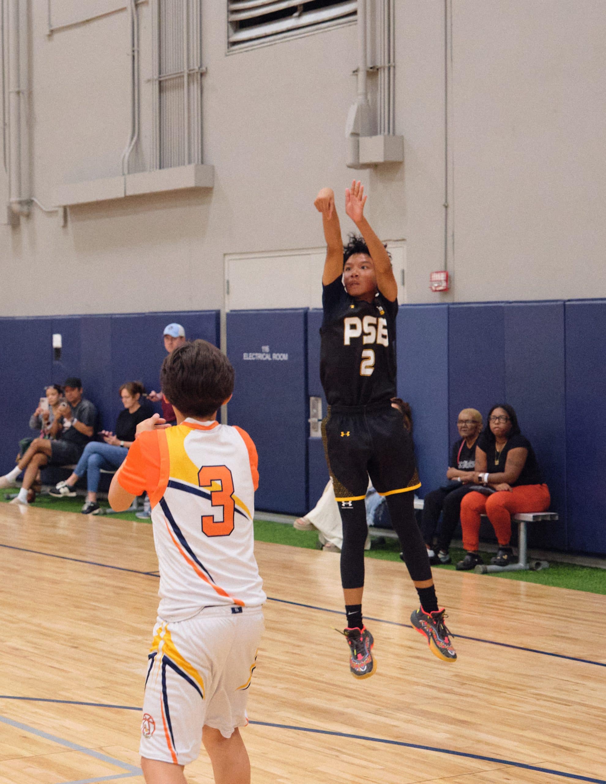 Teen basketball player on the sideline during a game