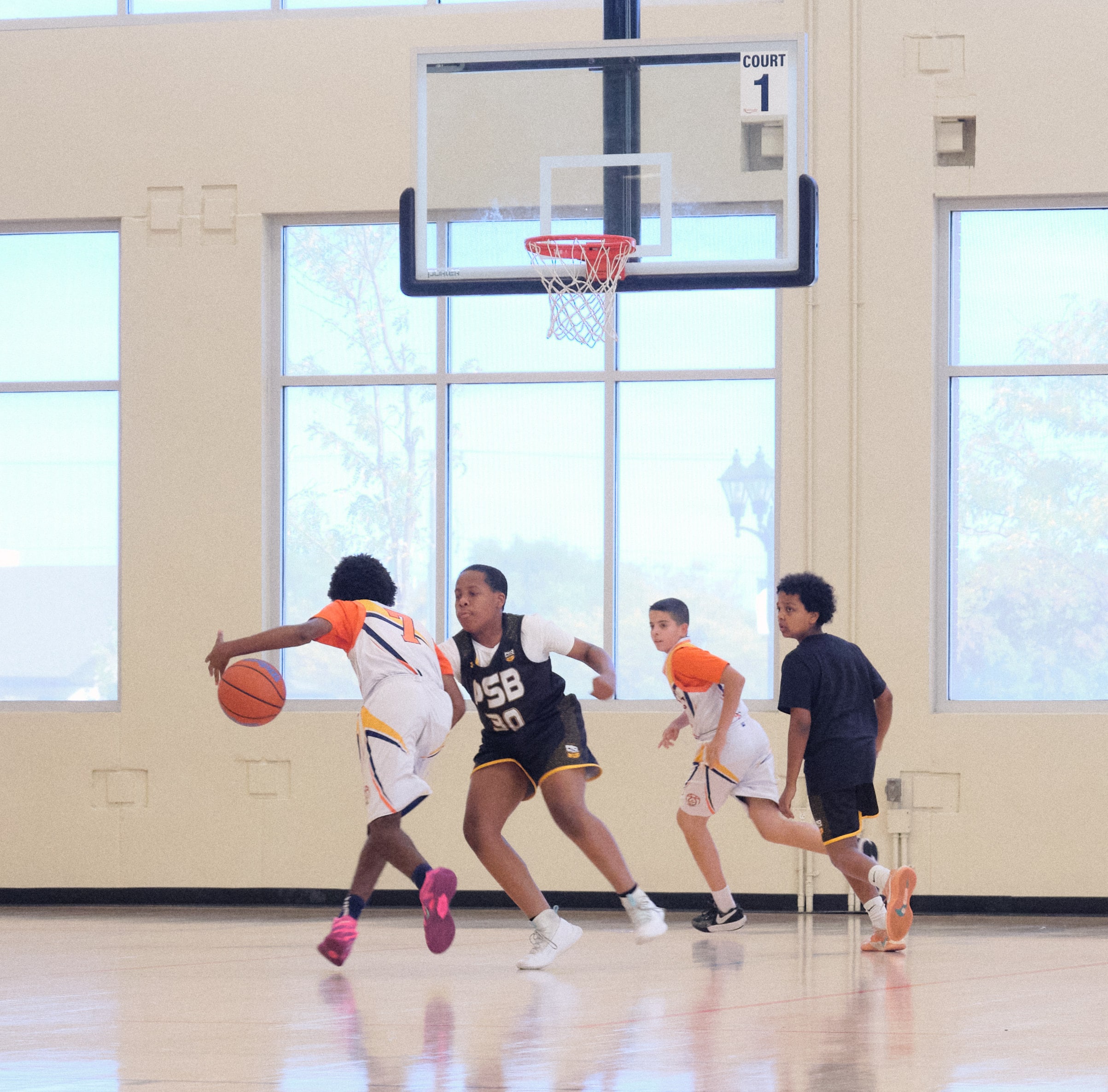 Youth basketball player scoring in the paint during a game