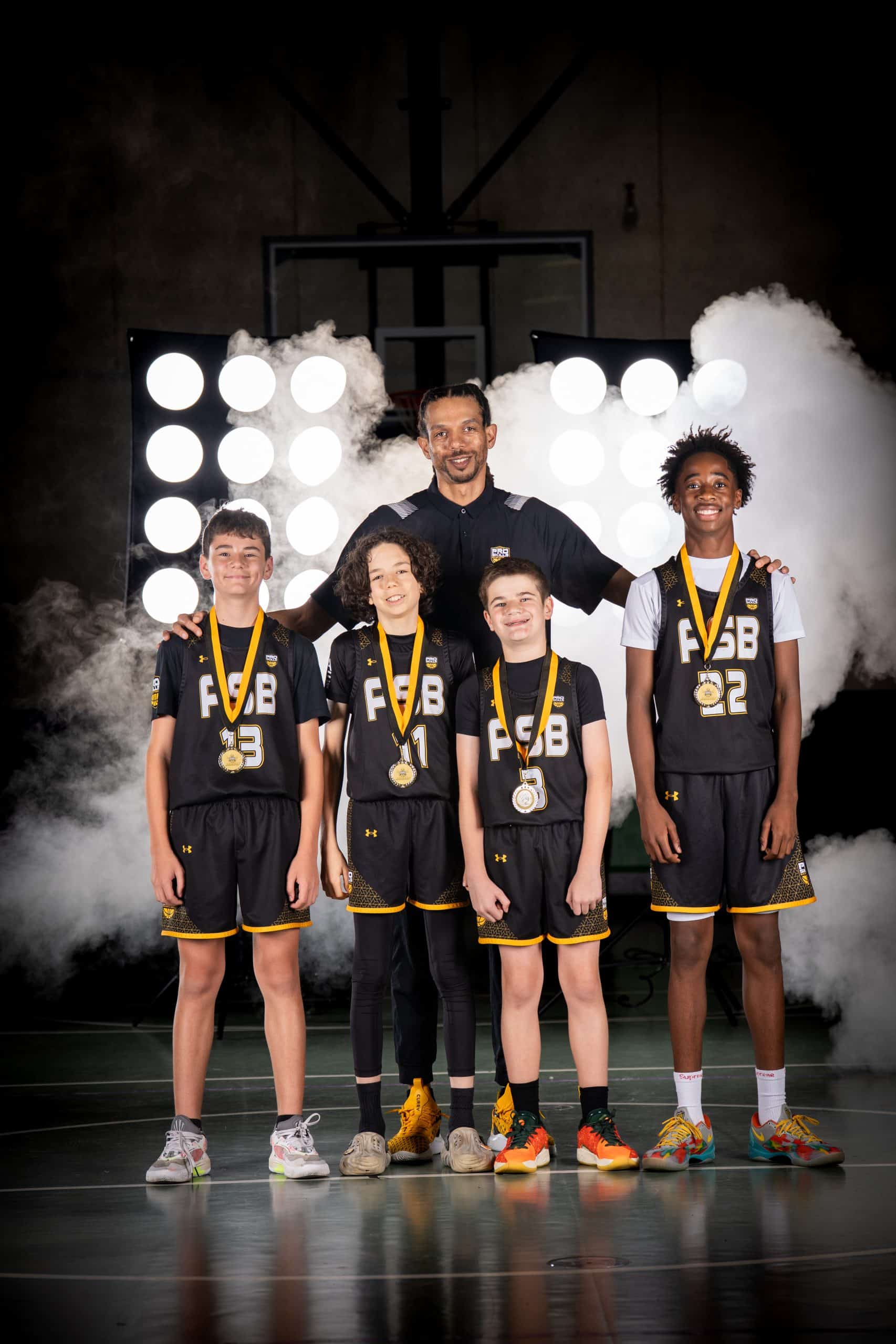 Pro Skills Basketball team with their coach and medals
