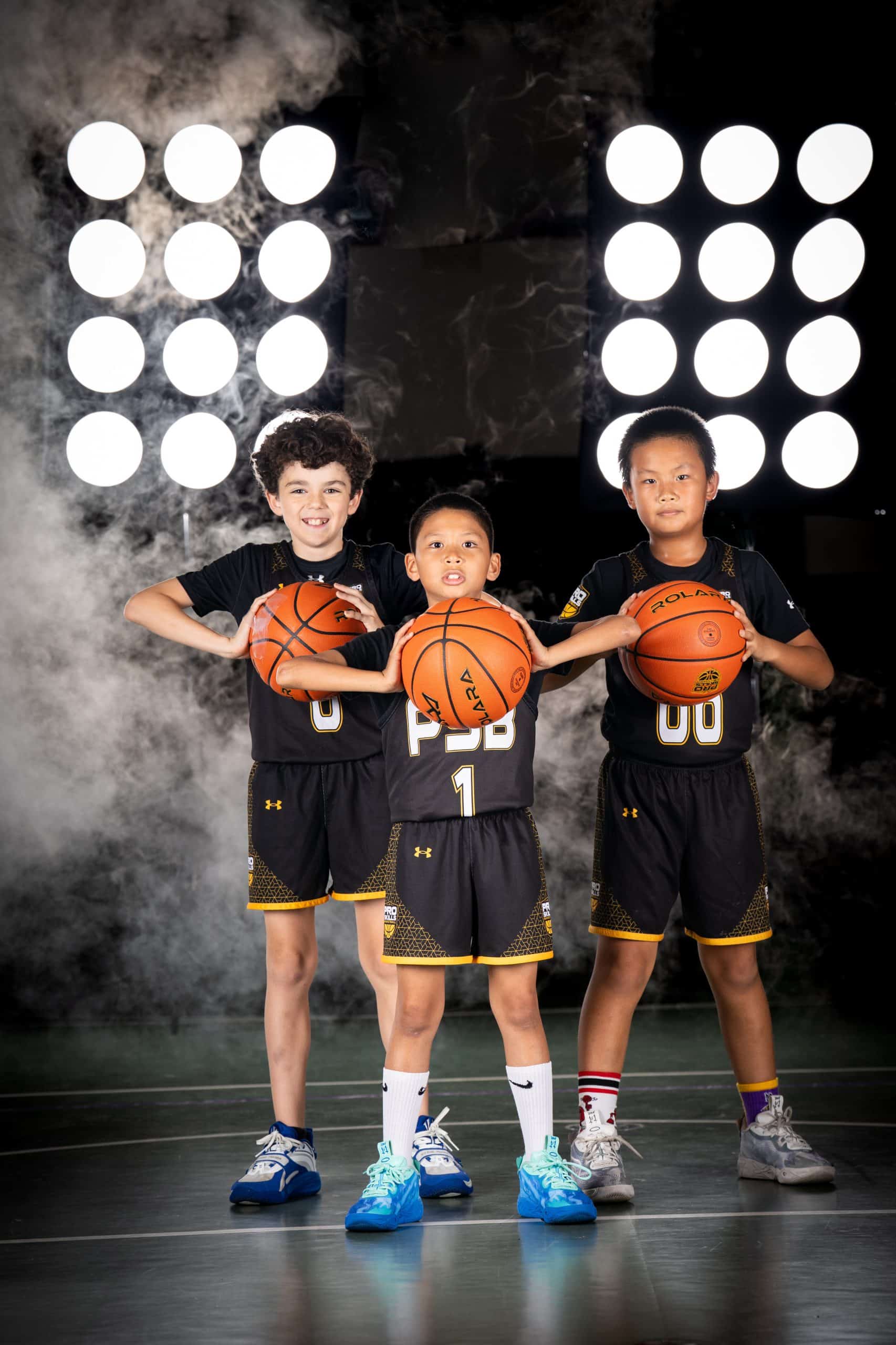 Young basketball players together at a Pro Skills Basketball team event