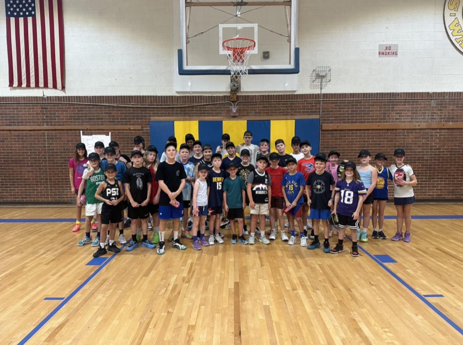 Group photo of youth basketball players at a PSB clinic